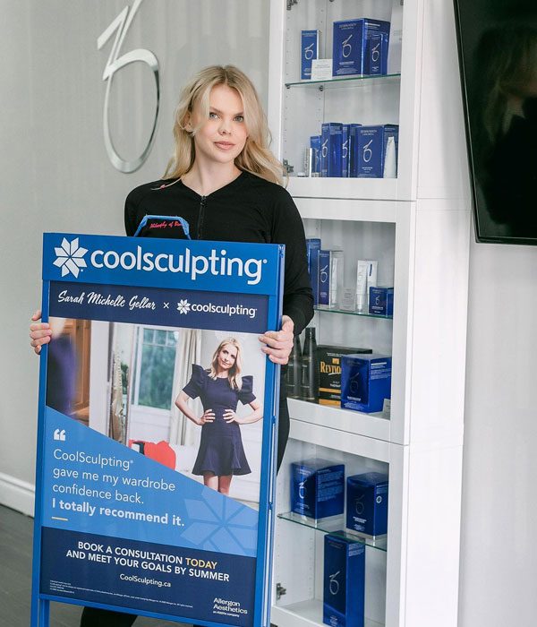 Team member with Coolsculpting banner